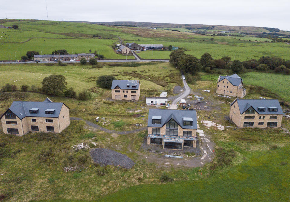 Drone images of mansions under threat of demolition, Bolton, Lancs. See SWNS story SWLEhouses; The owners of five luxury mansions which were built too big and in the wrong place face the threat of having their million-pound homes demolished. Residents wanted to broker a deal with a local council after it was found the properties were not built in accordance with planning permission. It had been hoped council chiefs would wave through the latest application after it was recommended for approval by town planners. But the revised plans, which involved knocking down and rebuilding two properties and reducing the size of another at a cost of more than Â£1m, was last week thrown out by councillors.