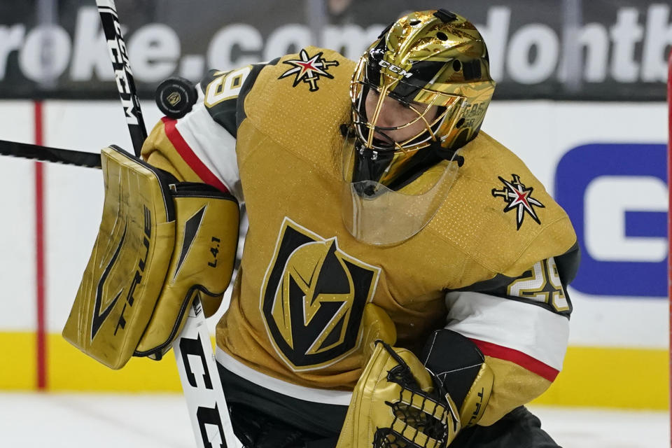 Vegas Golden Knights goaltender Marc-Andre Fleury (29) blocks a shot by the Colorado Avalanche during the third period of an NHL hockey game Sunday, Feb. 14, 2021, in Las Vegas. (AP Photo/John Locher)