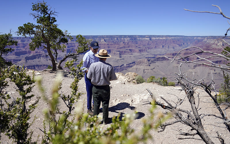President Biden talks with Ed Keable, superintendent of Grand Canyon National Park. Behind them is seen the Grand Canyon