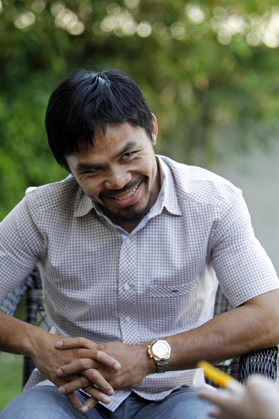 Manny Pacquiao, boxer and Philippine congressman speaks about his views on same-sex marriage at his home in Los Angeles on Wednesday, May 16, 2012. Pacquiao says he loves and supports gays and lesbians, even though he does not approve of gay marriage. (AP Photo/Reed Saxon)
