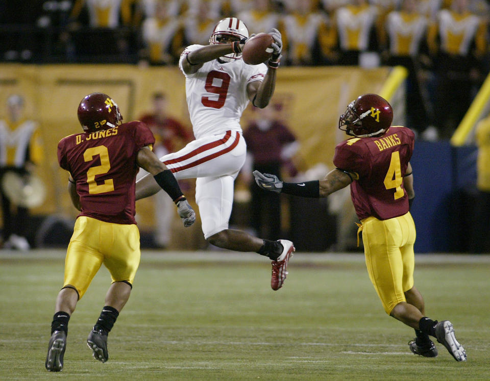 Oct. 15, 2005; Minneapolis, MN, USA; Wisconsin Badgers wide receiver #9 Jonathan Orr catches the ball for a 38 yard reception in the first half as Minnesota Gophers cornerback #4 Trumaine Banks and #2 Dominic Jones cover him at the Metrodome. Mandatory Credit: Photo By Bruce Kluckhohn-USA TODAY Sports Copyright (c) 2005 Bruce Kluckhohn