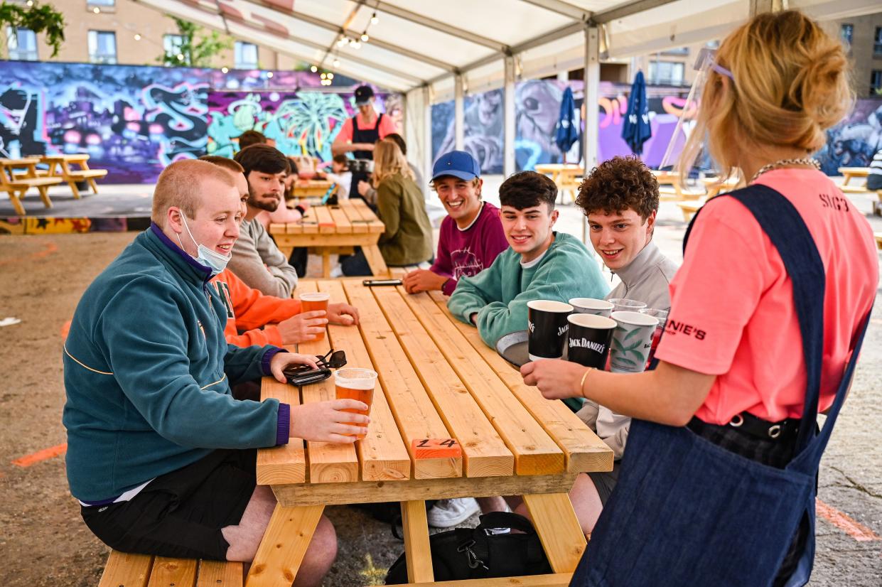 Members of the public enjoy their first drink in a beer garden at SWG3 on July 6, 2020, in Glasgow, Scotland.