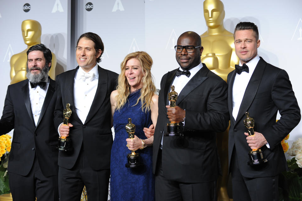 (L-R) Producers Anthony Katagas, Jeremy Kleiner, Dede Gardner, director Steve McQueen and Brad Pitt, winners of Best Picture for "12 Years a Slave", pose in the press room at Loews Hollywood Hotel. (Photo by Frank Trapper/Corbis via Getty Images)