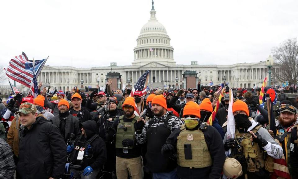 Proud Boys make ‘OK’ white power hand gestures near the Capitol, 6 January 2021.