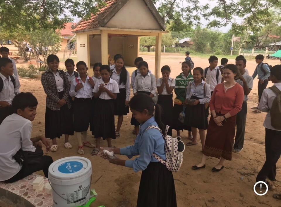 A photo of Brittany Baker, far right, with her students while she was a Peace Corps volunteer in Cambodia from 2016-2018.