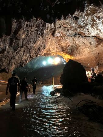 Rescue personnel walk in a cave at the Tham Luang cave complex during a mission to evacuate the remaining members of a soccer team trapped inside, in Chiang Rai, Thailand July 9, 2018, in this photo obtained from social media. MANDATORY CREDIT. Twitter @elonmusk/via REUTERS THIS IMAGE HAS BEEN SUPPLIED BY A THIRD PARTY. NO RESALES. NO ARCHIVES MANDATORY CREDIT. TPX IMAGES OF THE DAY - RC1BC2B4E200