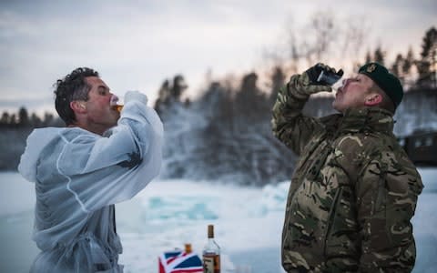 Defence Secretary Gavin Williamson drinks rum after doing the ice breaking drills in Bardufoss, Norway17 February 2019 - Credit: &nbsp;MoD