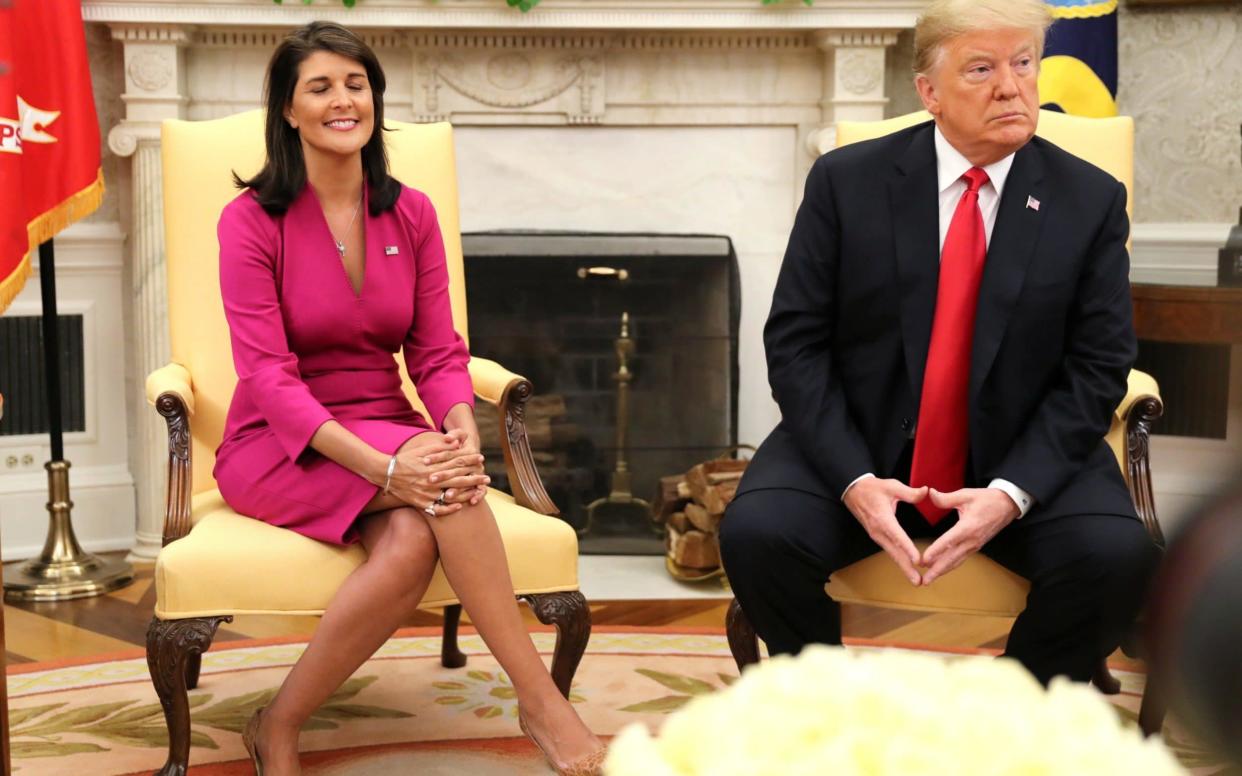 Nikki Haley and Donald Trump, announcing her resignation in the Oval Office on Tuesday - REUTERS