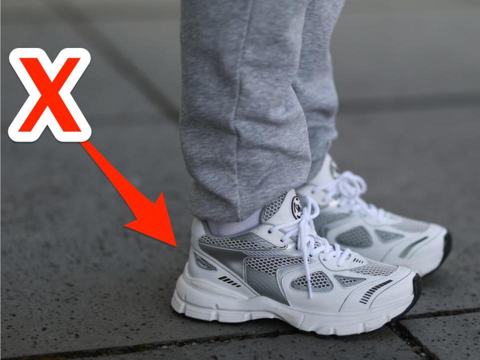 An X pointing at chunky sneakers.