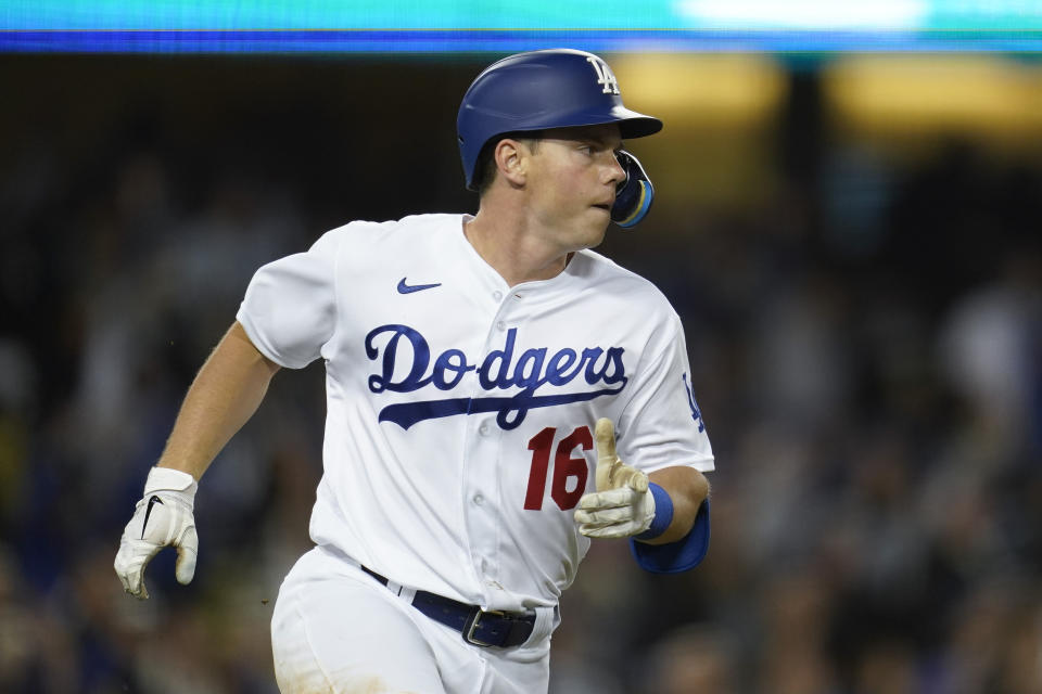 Los Angeles Dodgers' Will Smith (16) runs the bases after hitting a home run during the eighth inning of a baseball game against the Cincinnati Reds in Los Angeles, Thursday, April 14, 2022. Trea Turner and Justin Turner also scored. (AP Photo/Ashley Landis)