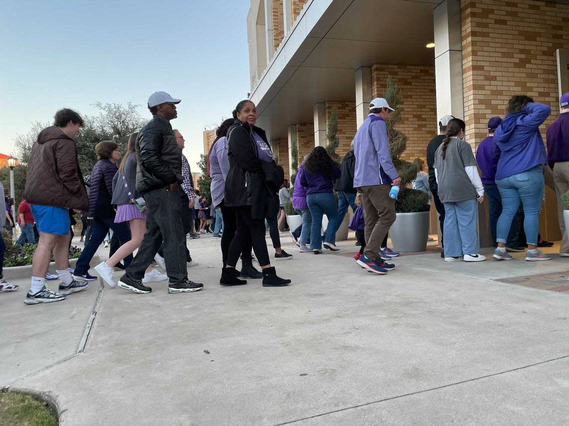 Horned Frogs football fans enter Schollmaier Arena on the TCU campus in Fort Worth for a watch party to cheer on the TCU team as they play Georgia for the national championship Monday, Jan. 9, 2023.