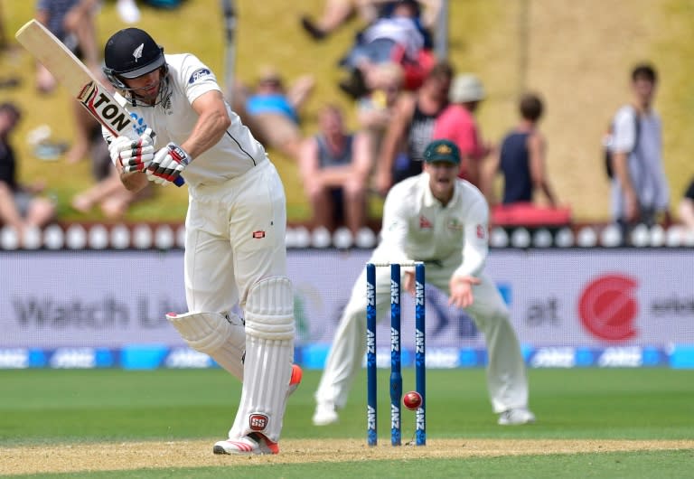 New Zealand's Doug Bracewell plays a shot during day four of the first Test against Australia in Wellington on February 15, 2016