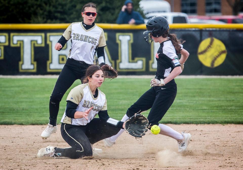 Daleville's Kali Kahalekomo attempts an out at second against Wapahani's Abi Cross during their game at Daleville High School Thursday, April 15, 2021. 