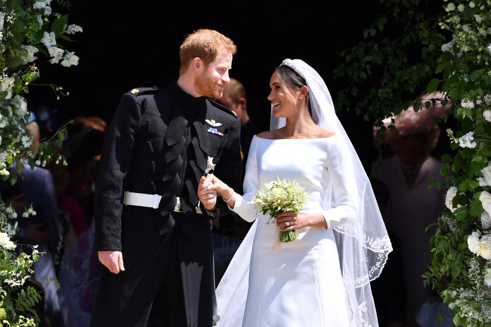 <p>Britain's Prince Harry, Duke of Sussex and his wife Meghan, Duchess of Sussex on the day of their wedding ceremony</p> (Photo by Ben STANSALL - WPA Pool/Getty Images)