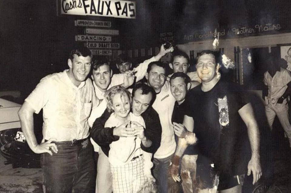 Cash Moore and a group of friends in front of Faux Pas