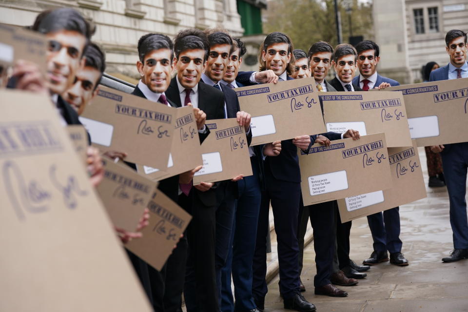 Campaigners dressed as Rishi Sunak protest outside the Treasury office, London, to coincide with the increase in National Insurance Contributions coming into effect. Picture date: Wednesday April 6, 2022. (Photo by Yui Mok/PA Images via Getty Images)