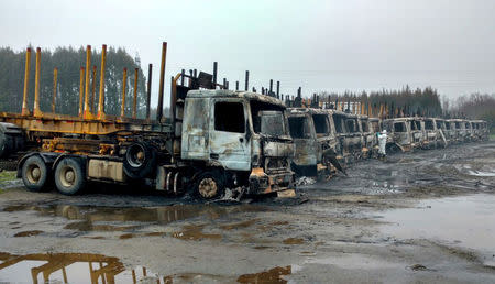 Burnt-out trucks are pictured in the San Jose de La Mariquina commue, south of Santiago, Chile August 28, 2017. REUTERS/Miguel Angel Bustos ATTENTION EDITORS - NO RESALES. NO ARCHIVES. CHILE OUT. NO COMMERCIAL OR EDITORIAL SALES IN CHILE