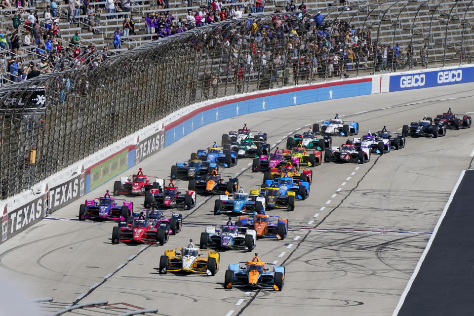 Racers vie for position at the beginning of the NTT IndyCar Series XPEL 375 at Texas Motor Speedway in Fort Worth, Texas, on Sunday, March 20, 2022. (AP Photo/Larry Papke)