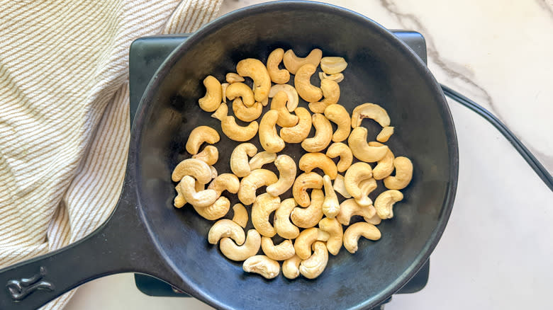 pan with cashews on burner