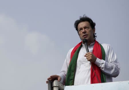Chairman of the Pakistan Tehreek-e-Insaf (PTI) political party Imran Khan addresses his supporters during what has been dubbed a "freedom march" in Islamabad August 21, 2014. REUTERS/Faisal Mahmood