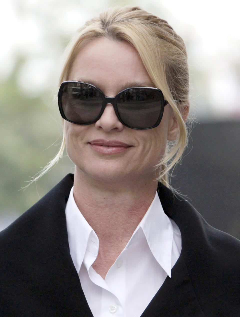 FILE - In this March 15, 2012 file photo, Nicollette Sheridan arrives at court in Los Angeles. A judge declared a mistrial Monday in Nicollette Sheridan's wrongful termination trial after the jury deadlocked, leaving an unresolved finale to a two-week trial that focused on the behind-the-scenes intrigue and personalities of TV's "Desperate Housewives." Sheridan claimed her role as Edie Britt was eliminated because she complained that series creator Marc Cherry struck her in the head during a September 2008 on-set dispute. She had been seeking roughly $6 million from against her former employers. (AP Photo/Nick Ut)