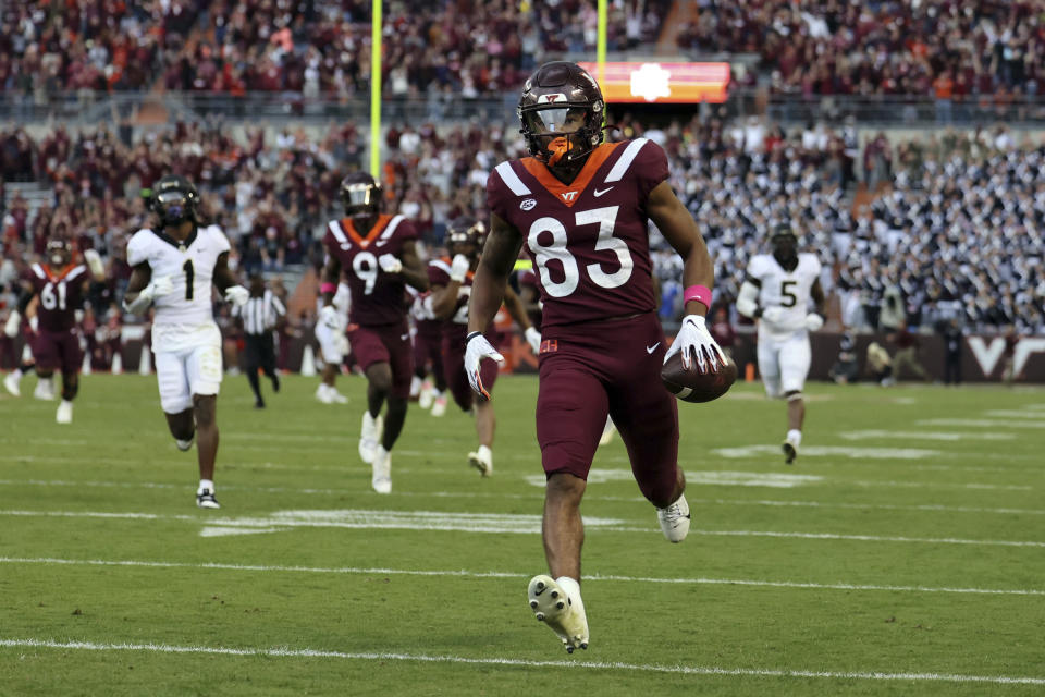 Virginia Tech wide receiver Jaylin Lane (83) scores on a 75-yard touchdown pass play from quarterback Kyron Drones in the second quarter of an NCAA college football game against Wake Forest in Blacksburg, Va., Saturday, Oct. 14, 2023. (Matt Gentry/The Roanoke Times via AP)