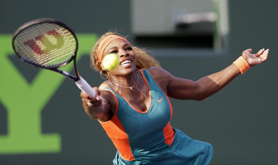 Serena Williams returns to Yaroslava Shvedova, of Kazakhstan, at the Sony Open tennis tournament in Key Biscayne, Fla., Thursday, March 20, 2014. (AP Photo/Alan Diaz)