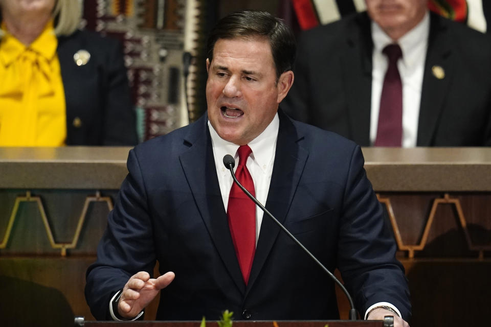 FILE - Arizona Republican Gov. Doug Ducey gives his state of the state address at the Arizona Capitol, Monday, Jan. 10, 2022, in Phoenix. Ducey is part of a burgeoning effort among establishment Republicans to lift up Karrin Taylor Robson against former television news anchor Kari Lake, who is backed by former President Donald Trump. (AP Photo/Ross D. Franklin, File)