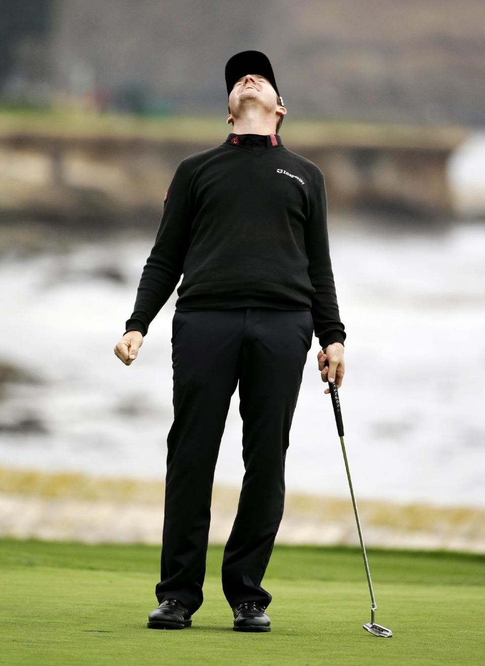 Jimmy Walker celebrates on the 18th green Sunday, Feb. 9, 2014, after winning the AT&T Pebble Beach Pro-Am golf tournament in Pebble Beach, Calif. (AP Photo/Eric Risberg)