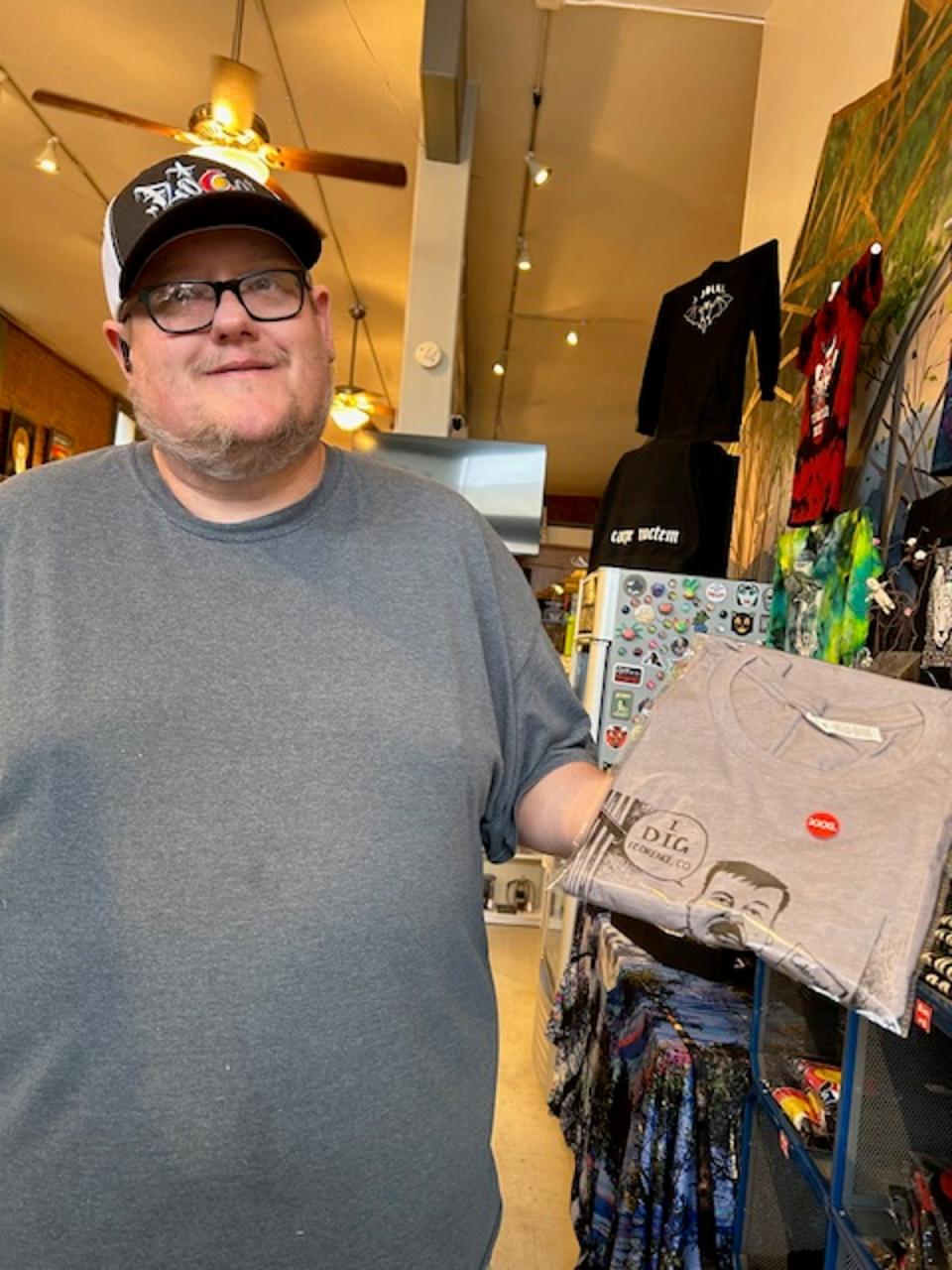 Bobby Davis, 45, sells El Chapo t-shirts at FloCo Gallery and Gifts on the Main Street of Florence, just a stone’s throw from the Supermax where the infamous drug kingpin is imprisoned (Sheila Flynn)