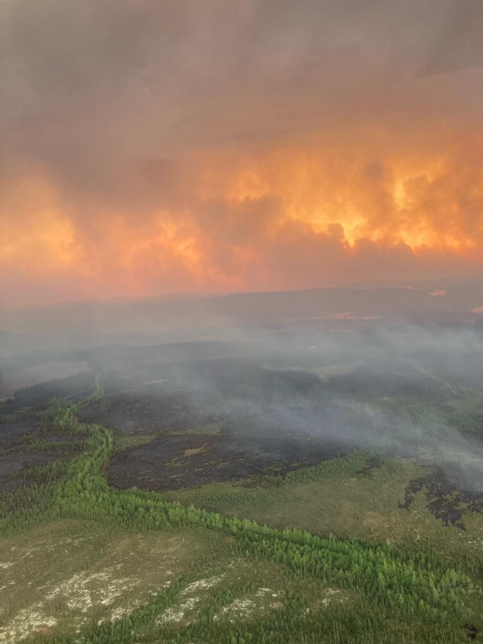 This handout image courtesy of helicopter pilot Kevin Burton shows an aerial view of wildfires between Chibougamau and the Mistissini Indigenous community in northern Quebec on June 5, 2023. C