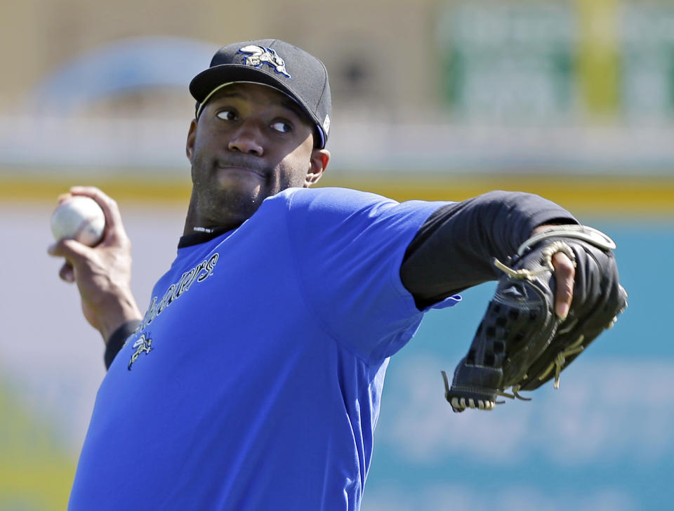 Retired NBA All-Star Tracy McGrady throws a pitch at the Sugar Land Skeeters baseball stadium Wednesday, Feb. 12, 2014, in Sugar Land, Texas. McGrady hopes to tryout as a pitcher for the independent Atlantic League Skeeters. (AP Photo/Pat Sullivan)