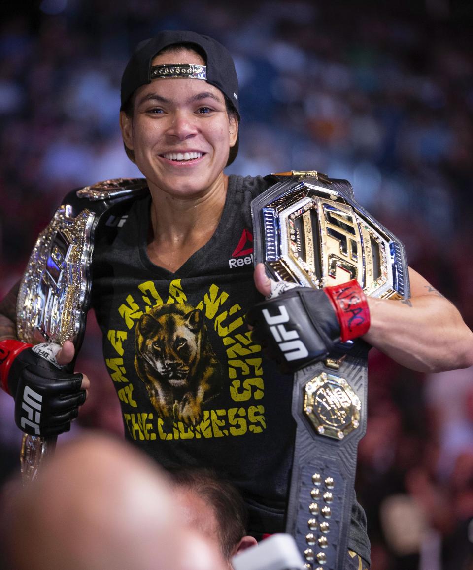 Amanda Nunes smiles after victory over Holly Holm during their women's bantamweight mixed martial arts title bout at UFC 239 on Saturday, July 6, 2019, in Las Vegas. Nunes won by first-round knockout. (AP Photo/Eric Jamison)