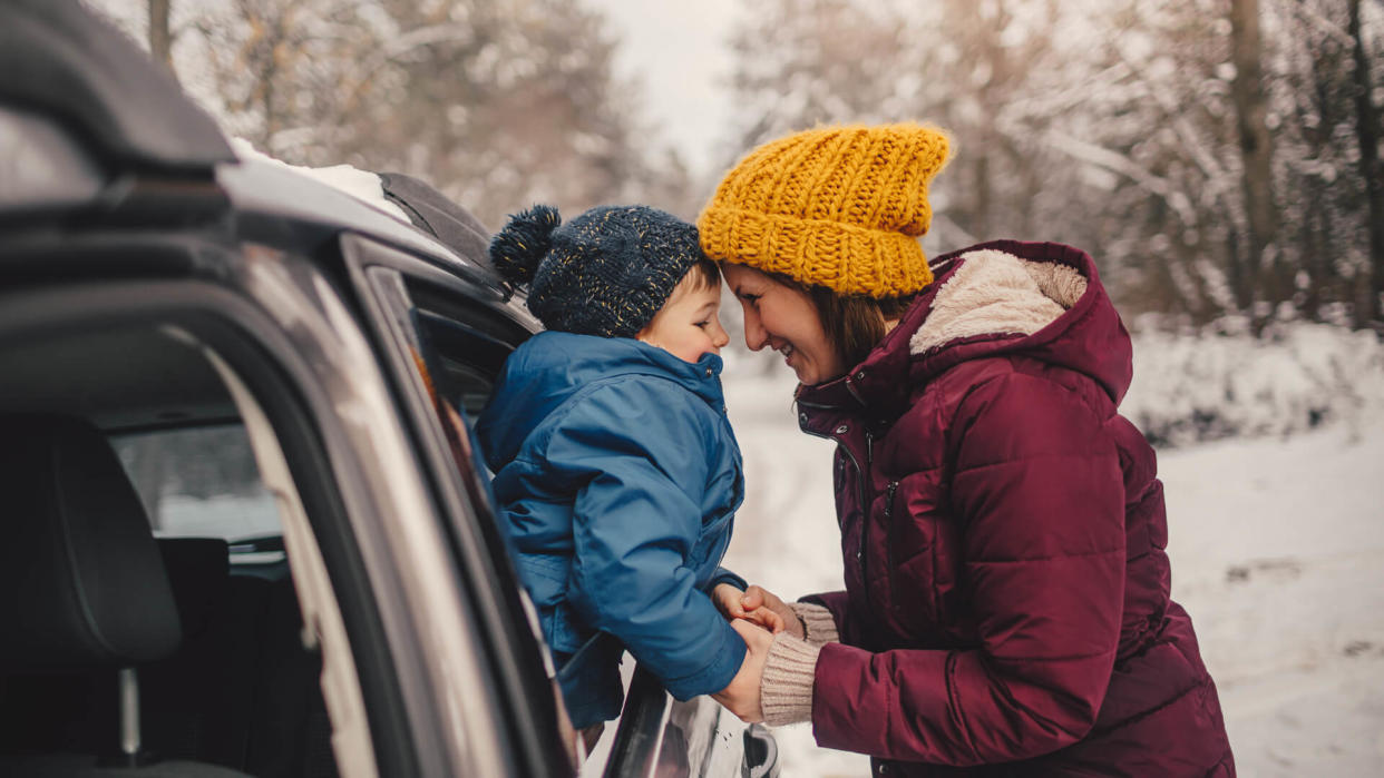 Mother and son on a winter road trip.