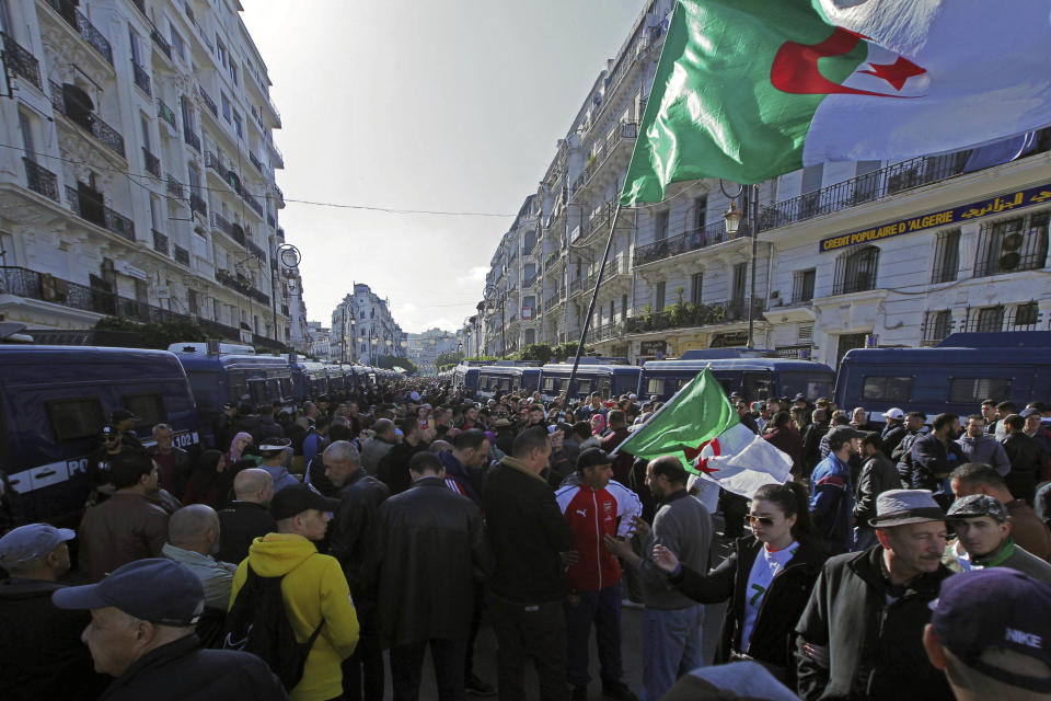 People take to the streets in the capital Algiers to protest against the government, for the 50th Friday running, in Algeria, Friday, Jan. 31, 2020. (AP Photo/Fateh Guidoum)
