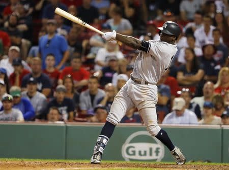 Jul 15, 2017; Boston, MA, USA; New York Yankees shortstop Didi Gregorius (18) follows through on a RBI single against the Boston Red Sox during the 16th inning at Fenway Park. Mandatory Credit: Winslow Townson-USA TODAY Sports