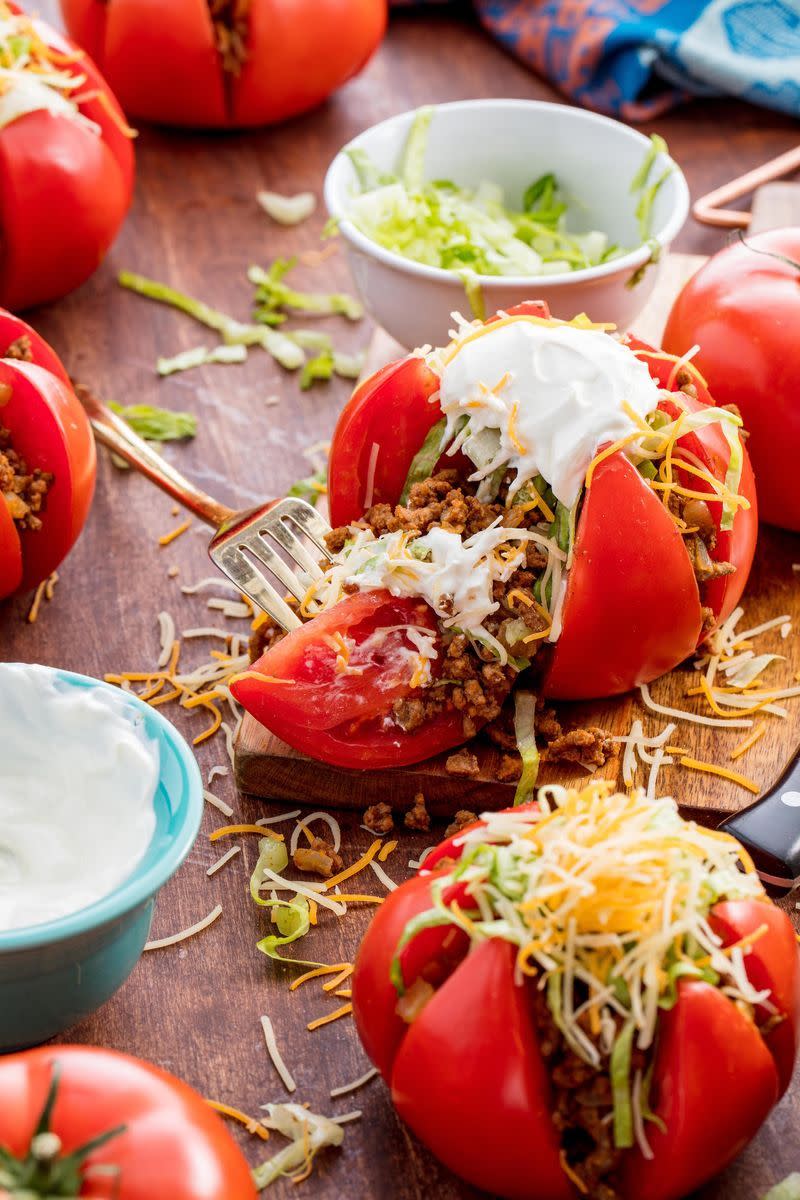 <p>We're all for a genius low carb hack — and these tomatoes totally deliver. We had never thought to stuff them with taco meat, cheese, and sour cream, but we'll do anything in the name of ditching a tortilla for a low carb meal.</p><p>Get the <a href="https://www.delish.com/uk/cooking/recipes/a30053026/taco-tomatoes-recipe/" rel="nofollow noopener" target="_blank" data-ylk="slk:Taco Tomatoes" class="link rapid-noclick-resp">Taco Tomatoes</a> recipe.</p>
