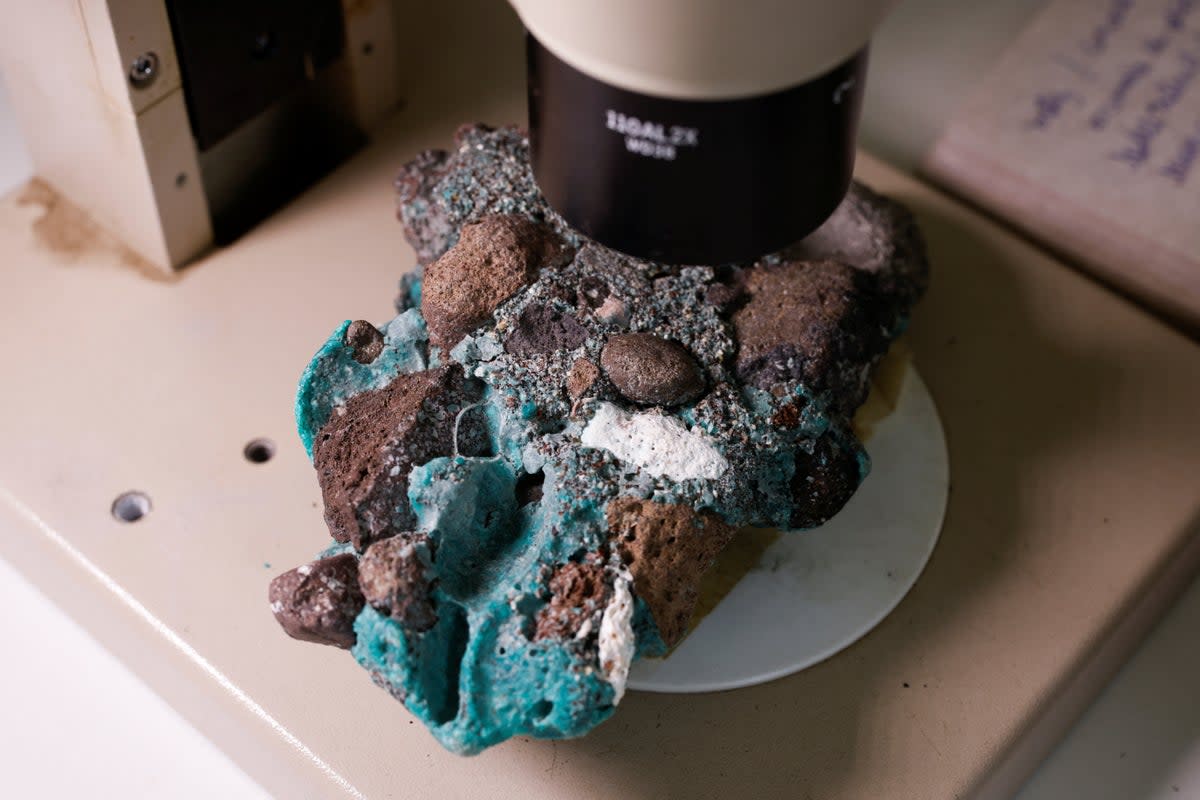 ‘Plastic rocks’ found on Trindade Island in the state of Espirito Santo is seen at the laboratory of the Federal University of Parana (REUTERS)