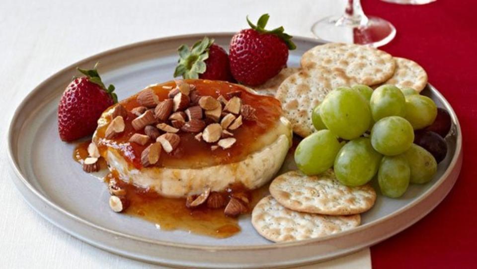 <p>Parade</p><p>Get ready to just say yum to this tasty baked brie, which features a savory-sweet combination of chutney and almonds. </p><p><strong>Get the Recipe: <a href="/28079/dash/baked-brie-with-chutney-and-almonds/" data-ylk="slk:Baked Brie with Chutney and Almonds;elm:context_link;itc:0;sec:content-canvas" class="link ">Baked Brie with Chutney and Almonds</a></strong></p>