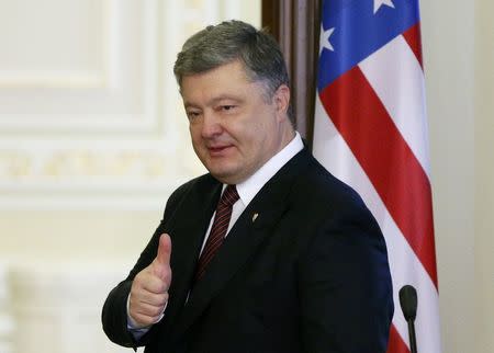 Ukrainian President Petro Poroshenko gestures during a news conference after a meeting with U.S. Vice President Joe Biden in Kiev, Ukraine, January 16, 2017. REUTERS/Gleb Garanich