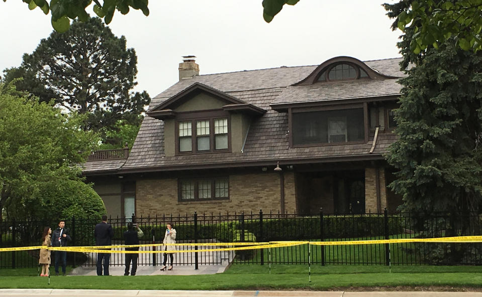 Fans take photos of Warren Buffett's house in Omaha, Nebraska, U.S. April 29, 2016. The yellow tape says 