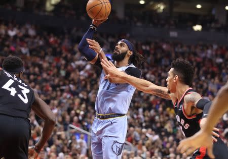 Jan 19, 2019; Toronto, Ontario, CAN; Memphis Grizzlies point guard Mike Conley (11) shoots in the second quarter against the Toronto Raptors at Scotiabank Arena. The Raptors beat the Grizzlies 119-90. Mandatory Credit: Tom Szczerbowski-USA TODAY Sports