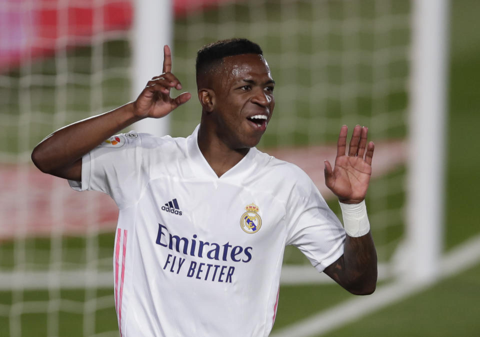 Real Madrid's Vinicius Junior runs to celebrate after scoring during the Spanish La Liga soccer match between Real Madrid and Valladolid at Alfredo di Stefano stadium in Madrid, Spain, Wednesday, Sept. 30, 2020. (AP Photo/Manu Fernandez)