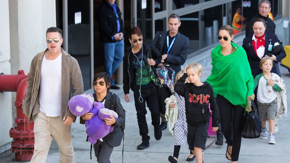 Brad Pitt and Angelina Jolie with their children in 2014 in Los Angeles. - GVK/Bauer-Griffin/Getty Images