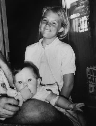 <p>Kim Komenich/Getty</p> Jaycee Dugard smiling as she stands next to her baby half-sister Shana.