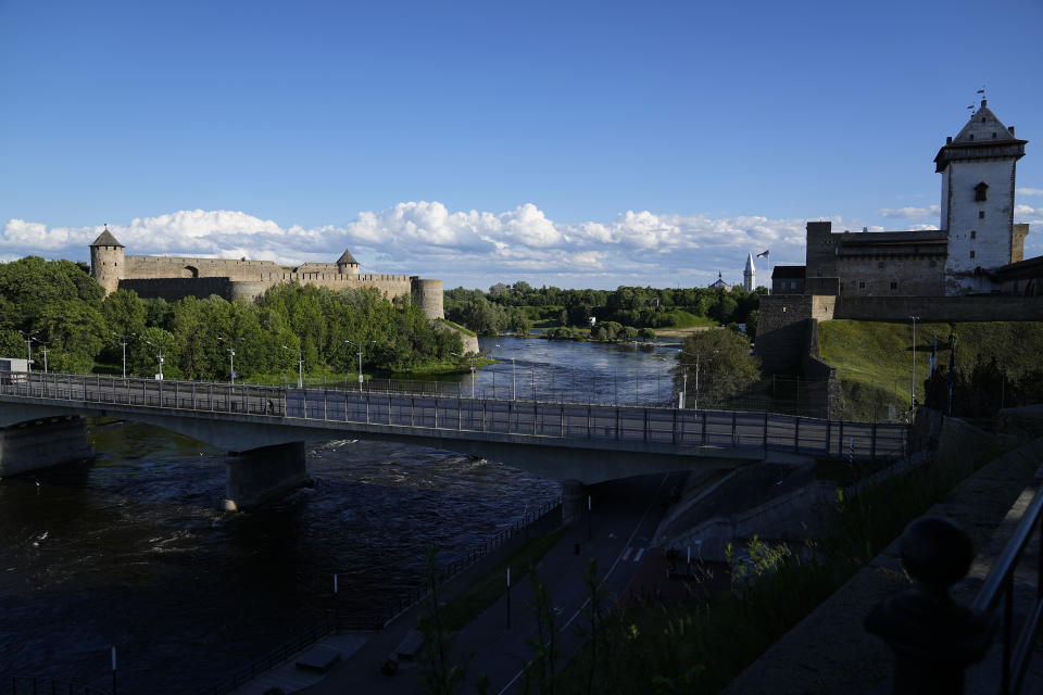 A bridge straddles Ivangorod, Russia, left, and a border crossing in Narva, Estonia, Thursday, June 16, 2022. (AP Photo)