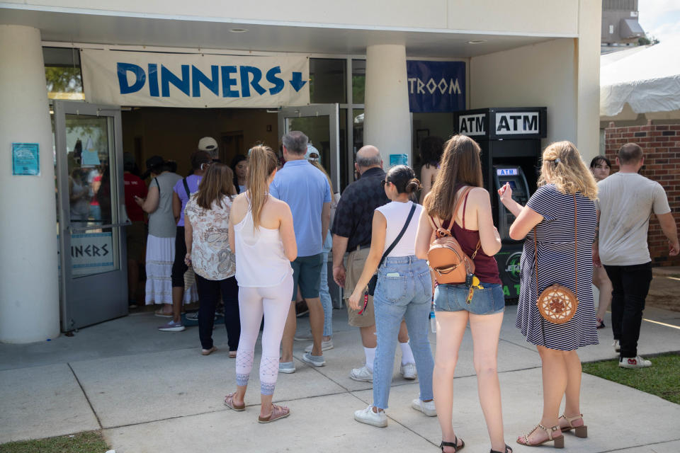 Tallahassee Greek Food Festival attendees wait in line for food at Holy Mother of God Greek Orthodox Church Saturday, Oct. 16, 2021. 