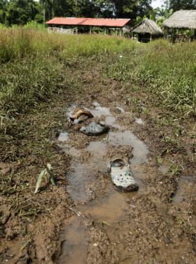 Abandoned Crocs near the improvised temple where a pregnant woman, five of her children and a neighbour were killed.