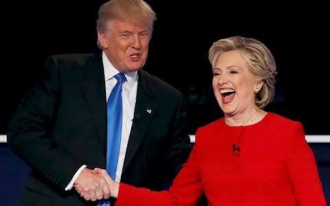 Donald Trump shakes hands with Hillary Clinton at the conclusion of their first presidential debate - Credit: Reuters