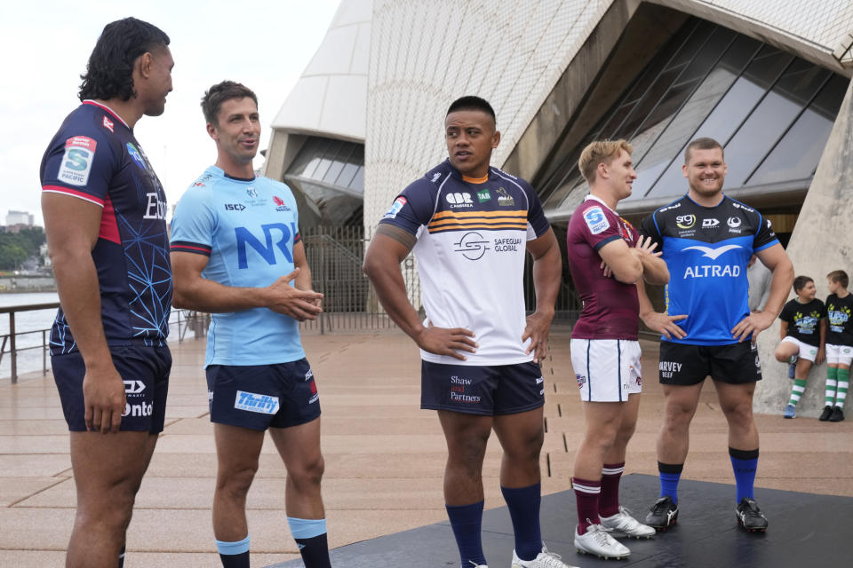 Team captains, Rob Leota, Melbourne Rebels, left, Jake Gordon, NSW Waratahs, second left, Alan Alaalatoa, ACT Brumbies, Tate McDermott, QLD Reds, second right, and Tom Robertson, Western Force, right, pose for a photo during the launch of the 2023 season of the Super Rugby Pacific competition in Sydney, Wednesday, Feb. 15, 2023. (AP Photo/Rick Rycroft)